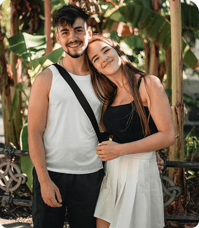 Two people side by side in soft daylight